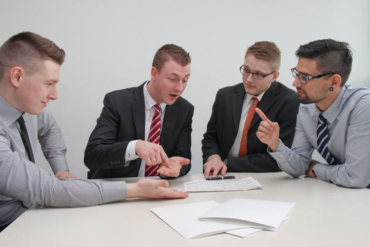 A group of men having a discussion.