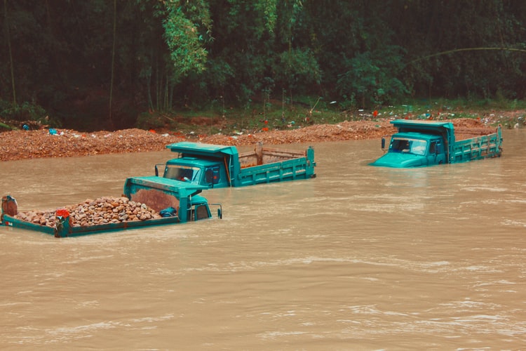 Trucks covered by a flood.