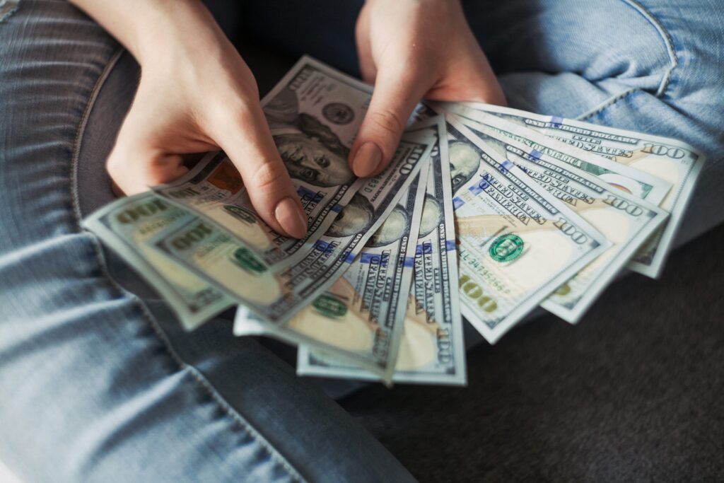 American money being held in someone's hands