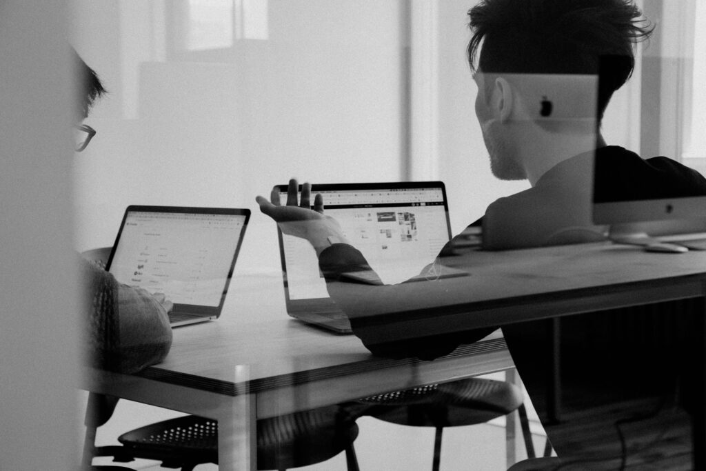 Peering into peer review Individuals working on laptops