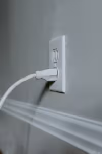 Electrical chord plugged into an outlet